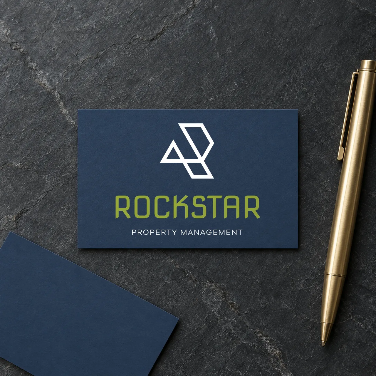 Rockstar Property Management logo on business cards (mockup), designed by Sharp Design