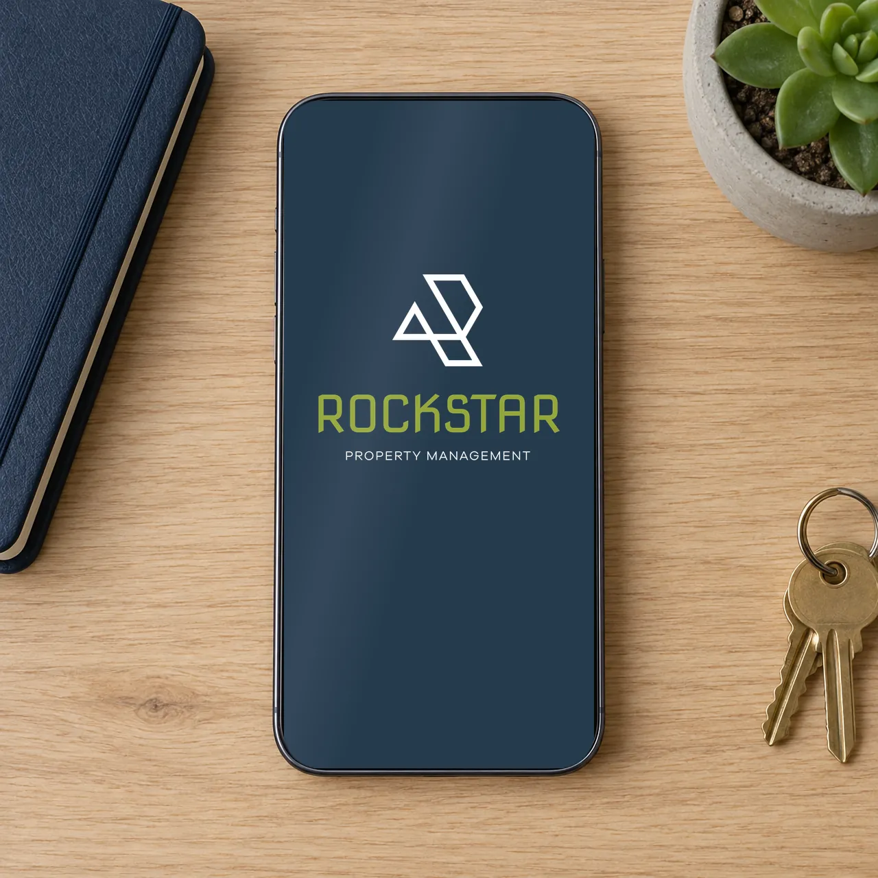 Rockstar Property Management logo on a phone screen (mockup), designed by Sharp Design